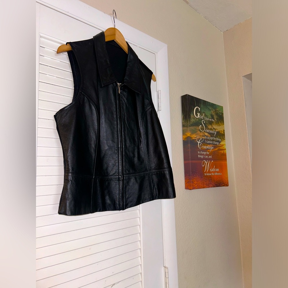 Leather vest with intricate details.